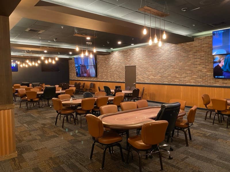 Gaming room with warm brown and dark accent walls in Seabrook, NH